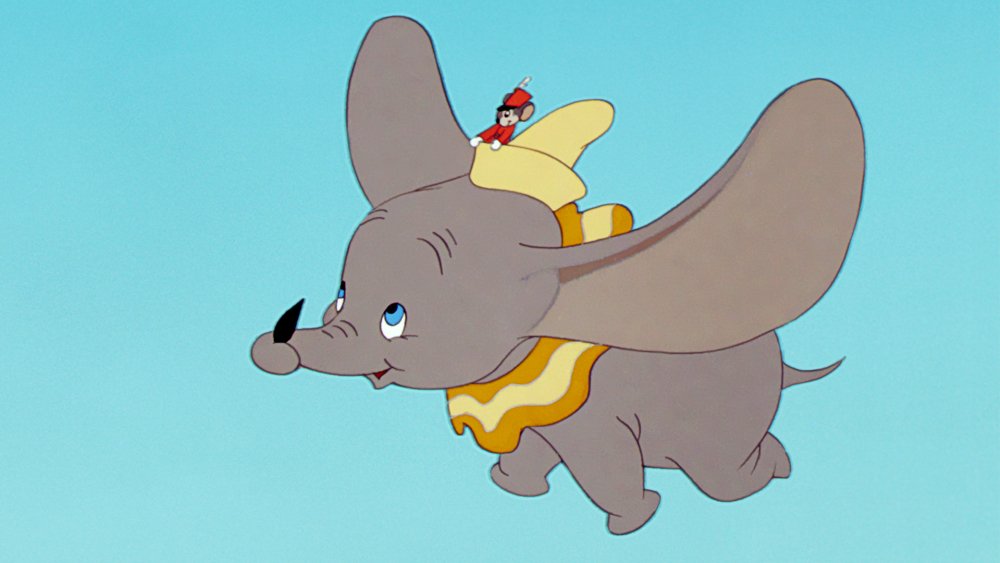 Dumbo flying on a blue background